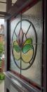 Repaired front door window set into a new surround